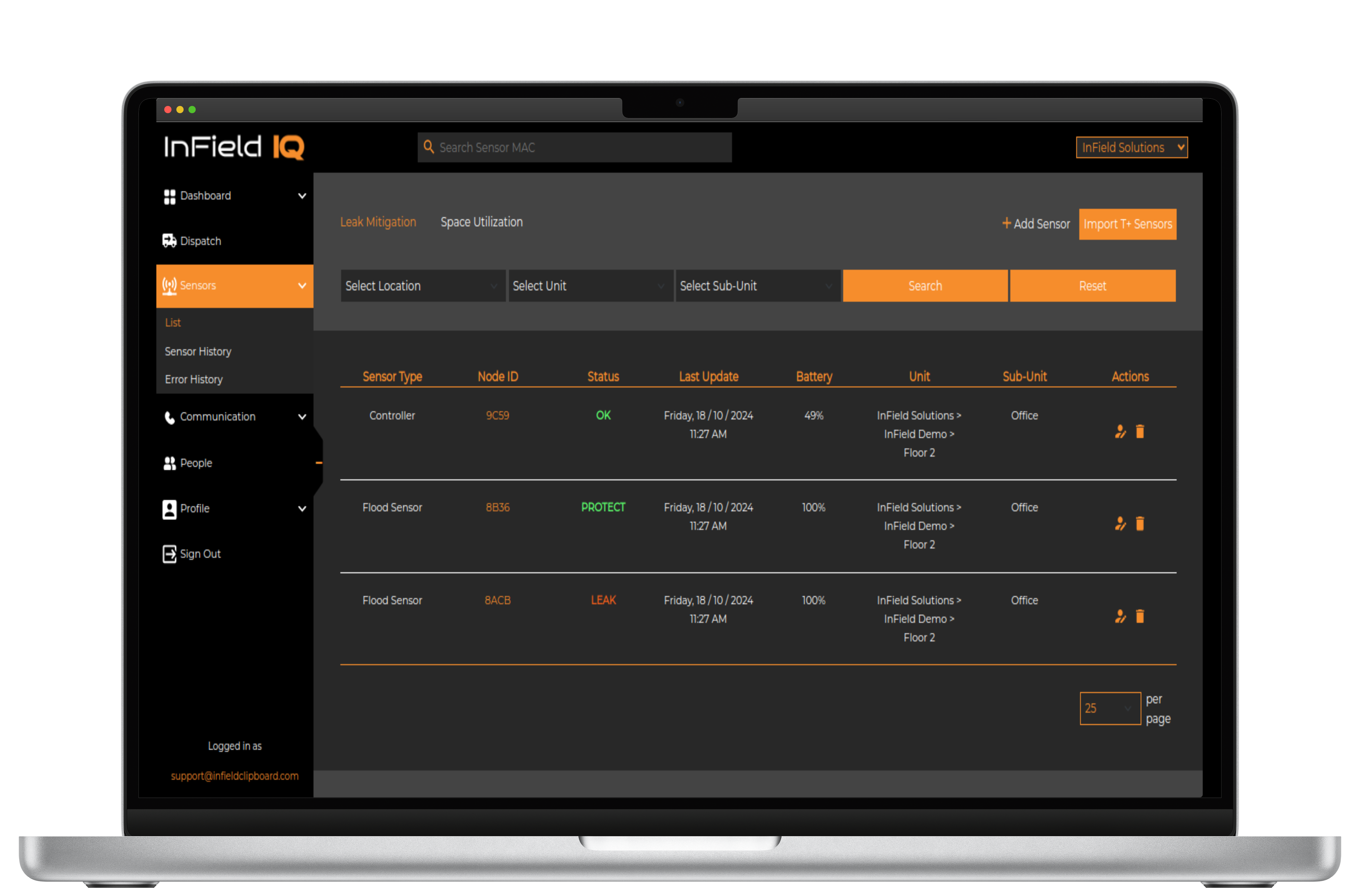 A portrait of a girl under hanging flowers.